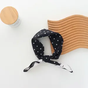 Classic black and white polka dot scarf headband, retro French style hair accessory for women.