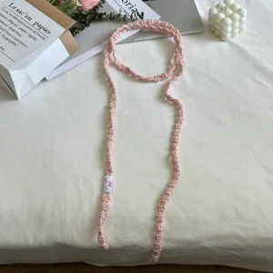Pink handmade crochet ribbon detail, sweet cool girl neck strap, soft fabric texture.