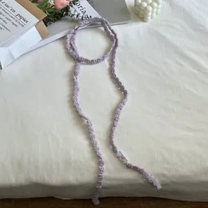 Detailed closeup view of a pastel purple handmade crochet ribbon, sweet style neckband accessory.