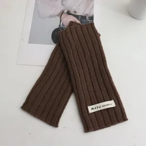 Brown knitted fingerless gloves detail view, soft wool arm warmers for autumn and winter.