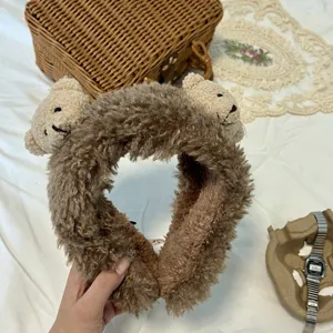 Cute plush bear earmuffs for women, soft winter warm ear covers, cozy cold-weather gear.