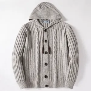 Detailed view of the thick warm cable knit hoodie cardigan featuring front buttons and drawstring.