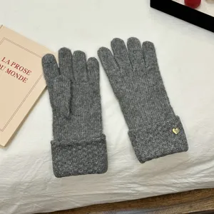 Warm winter knitted touch screen gloves with elegant heart detail for women cozy cold weather style