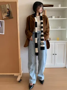 Black and white striped knitted scarf, trendy narrow long winter scarf, fashion apparel accessory.