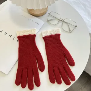 Winter red knit touchscreen gloves with white lace cuffs for women, warm and stylish.