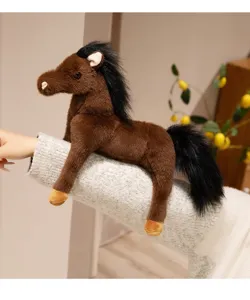 Detail view of cute brown plush horse toy draped on arm, soft stuffed pony for kids gift.
