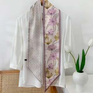 Detailed view of long silk scarf with floral and geometric prints, ideal as neck or bag ribbon.