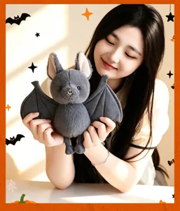 Close-up detail view of the cute gray bat plush toy showcasing soft texture and cute wings.