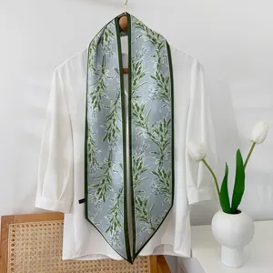 Green floral silk narrow long scarf ribbon for bag hair head neck decoration detail view.