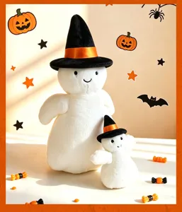 Detailed close-up shot of cute white ghost plush toys wearing witch hats for Halloween decor.