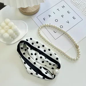 Chic black and white polka dot silk scarf with large pearl magnetic buckle and pearl necklace.