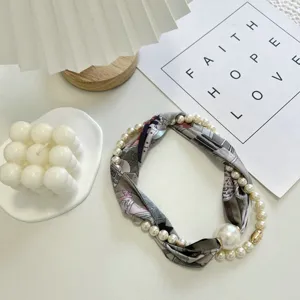 Elegant women pearl silk scarf necklace with magnetic clasp, stylish decorative neck accessory.