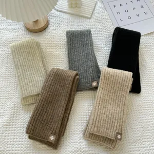 Detailed view of long ribbed knit leg warmers and sleeves in various autumn winter colors.