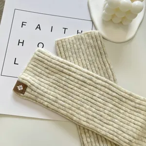 Detailed view of cozy knit leg warmers and arm warmers for women, warm winter ribbed style.