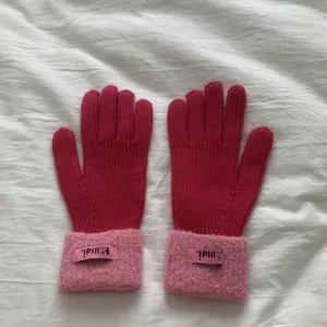Detailed view of women winter knitted gloves with fuzzy cuffs and warm thick stretch fabric.