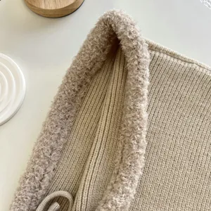 Detailed view of knitted balaclava shawl hat texture, cozy fleece trim, winter warm solid beige