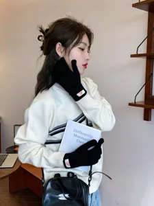 Cute winter knit gloves for women, warm five-finger design, soft fabric, stylish daily wear.
