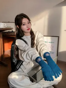 Winter long knit gloves for women, cozy thermal arm warmers, cute student cold weather gear.
