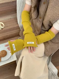Mitaines tricotées jaunes gants sans doigts pour femmes, longues manches côtelées.