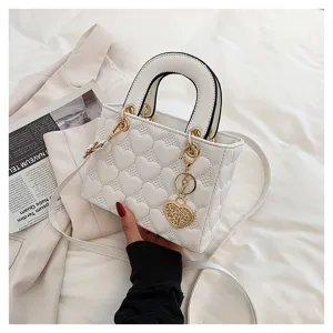 White heart quilted leather handbag with top handle and strap for women fashion daily wear.