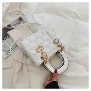 White heart quilted shoulder bag with top handle and gold hardware details for women.