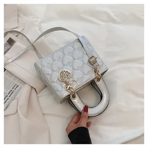 Stylish glossy heart quilted women shoulder handbag with metal chain and chic cute heart charm.