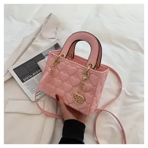 Pink heart quilted handbag fashion women shoulder crossbody bag with metal charm and top handle.