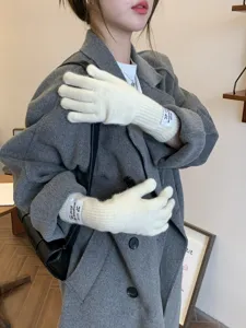 Winter warm knitted long gloves for women, solid white ribbed five-finger thermal gloves.