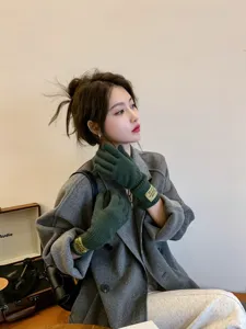 Winter warm knitted five-finger gloves for women, stylish dark green thick winter gloves.