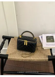 Black quilted chain handbag, luxury top handle vanity bag, elegant fashion shoulder crossbody.