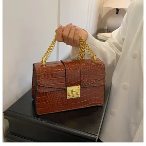 Brown crocodile texture shoulder bag with gold chain and lock detail, elegant daily handbag.