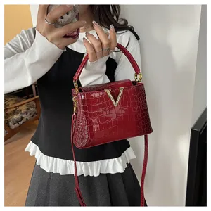 Red crocodile pattern leather handbag for women, stylish top handle tote and crossbody bag.