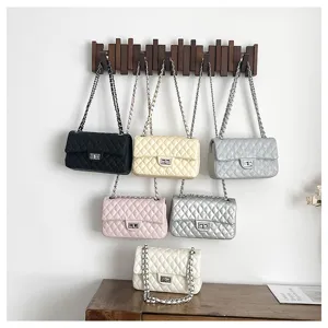 Quilted chain shoulder bag for women, elegant commuter crossbody bag with classic pattern.