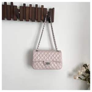 Pink quilted chain shoulder bag, classic turn-lock design, elegant commuting handbag.