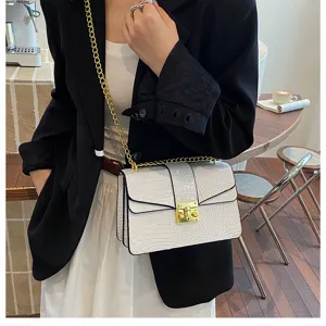 Chic white crocodile pattern chain shoulder bag with metal lock for stylish women daily use.