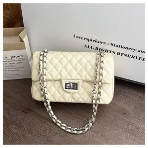 Stylish quilted chain shoulder bag for women, elegant commuter crossbody bag with flap and lock.