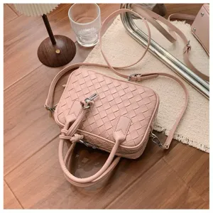 Stylish pink woven leather top handle handbag, chic casual shoulder crossbody small square bag.