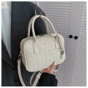 Elegant white woven leather handbag, casual shoulder crossbody bag with top handle and strap.