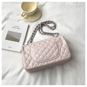 Fashion pink quilted chain shoulder bag for women, elegant commuter crossbody handbag.