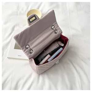 Chic pink quilted chain shoulder bag for women, elegant daily crossbody bag with spacious interior.