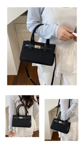 Elegant black top handle crossbody bag with gold turn-lock closure for women daily wear.
