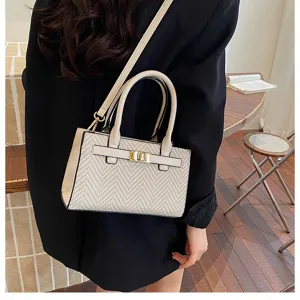 Stylish contrast color women shoulder handbag with top handle and metal lock detail.