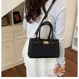 Stylish black structured crossbody handbag with top handle and gold metal lock design for women.