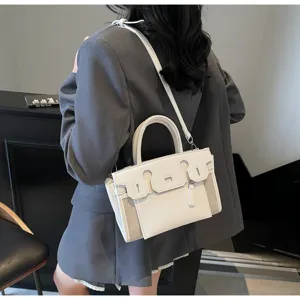 Detailed view of stylish white contrast shoulder bag with premium handle and versatile strap.