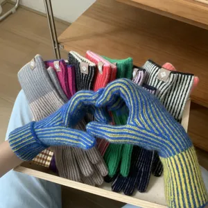Knit striped fingerless gloves detail view, colorful winter warm woolen gloves for women.