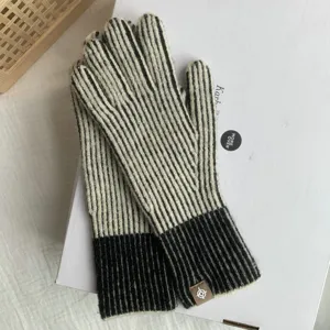 Black and white striped knitted gloves for women, cozy winter warm thermal full finger gloves.
