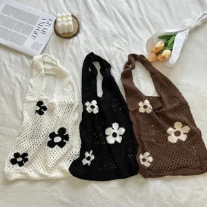 Detailed shot of Korean vintage hollow knitted floral tote bag, casual shoulder shopping bag.
