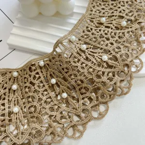 Beige lace fake collar detail shot showing delicate hollow crochet pattern and white pearls.