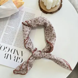 Detailed view of the vintage floral cotton linen small square scarf hair band accessory.