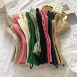 Winter warm knitted gloves multi-color collection showing soft plush texture and detailed craftsmanship.